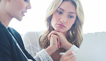 Woman meeting with nurse reviewing documents